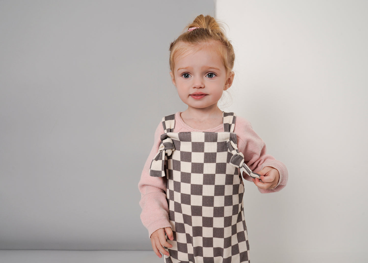 checked dungarees on model