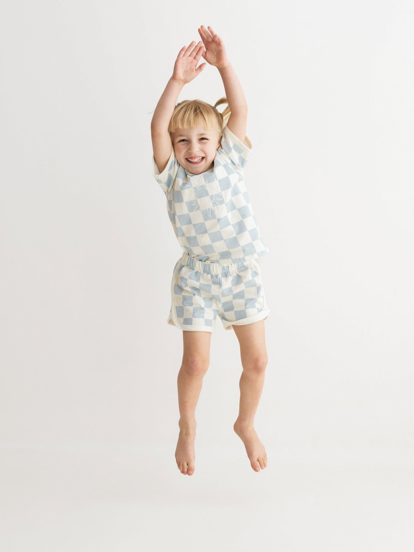 checked blue shorts and t-shirt