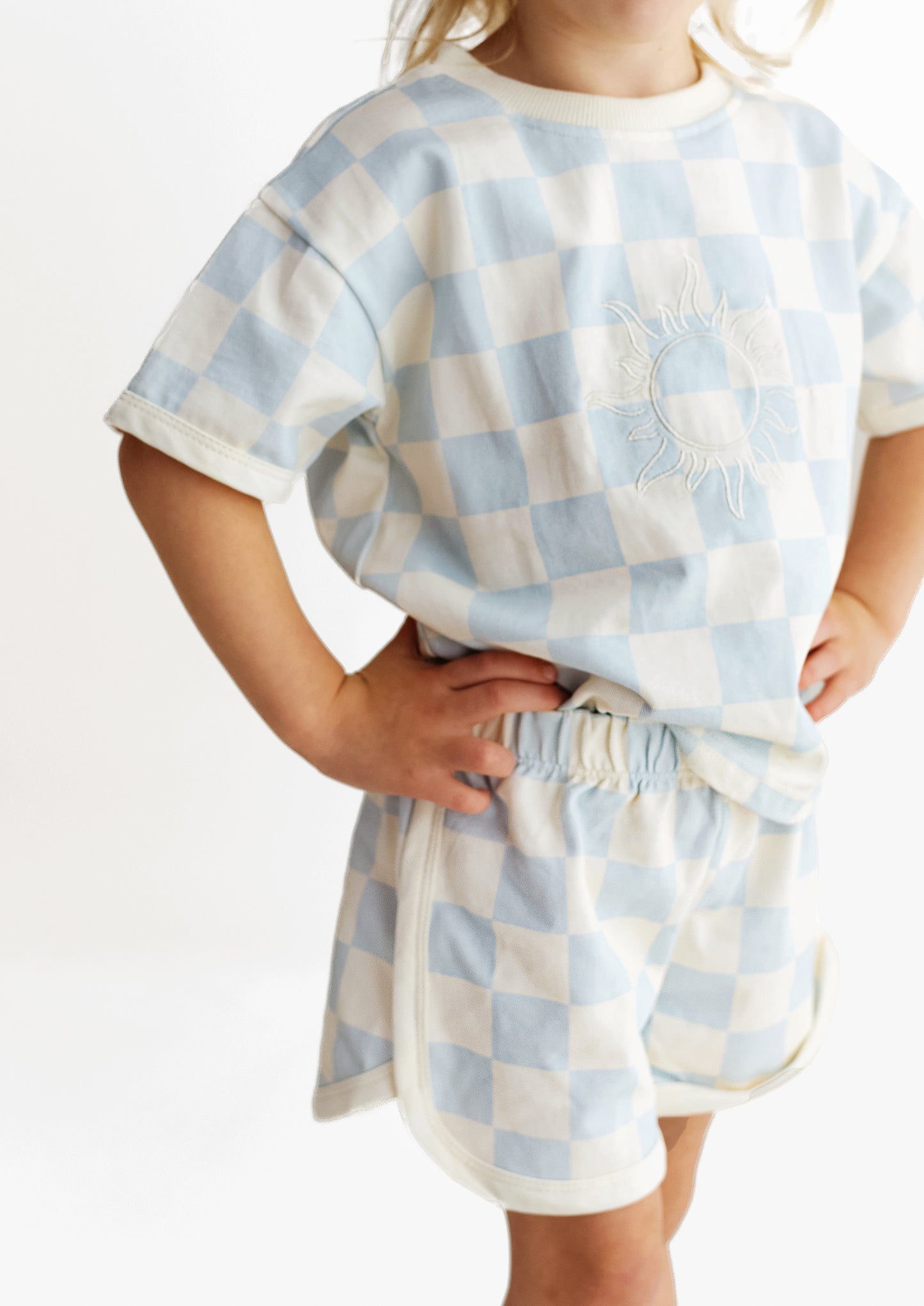 checked blue t-shirt and shorts