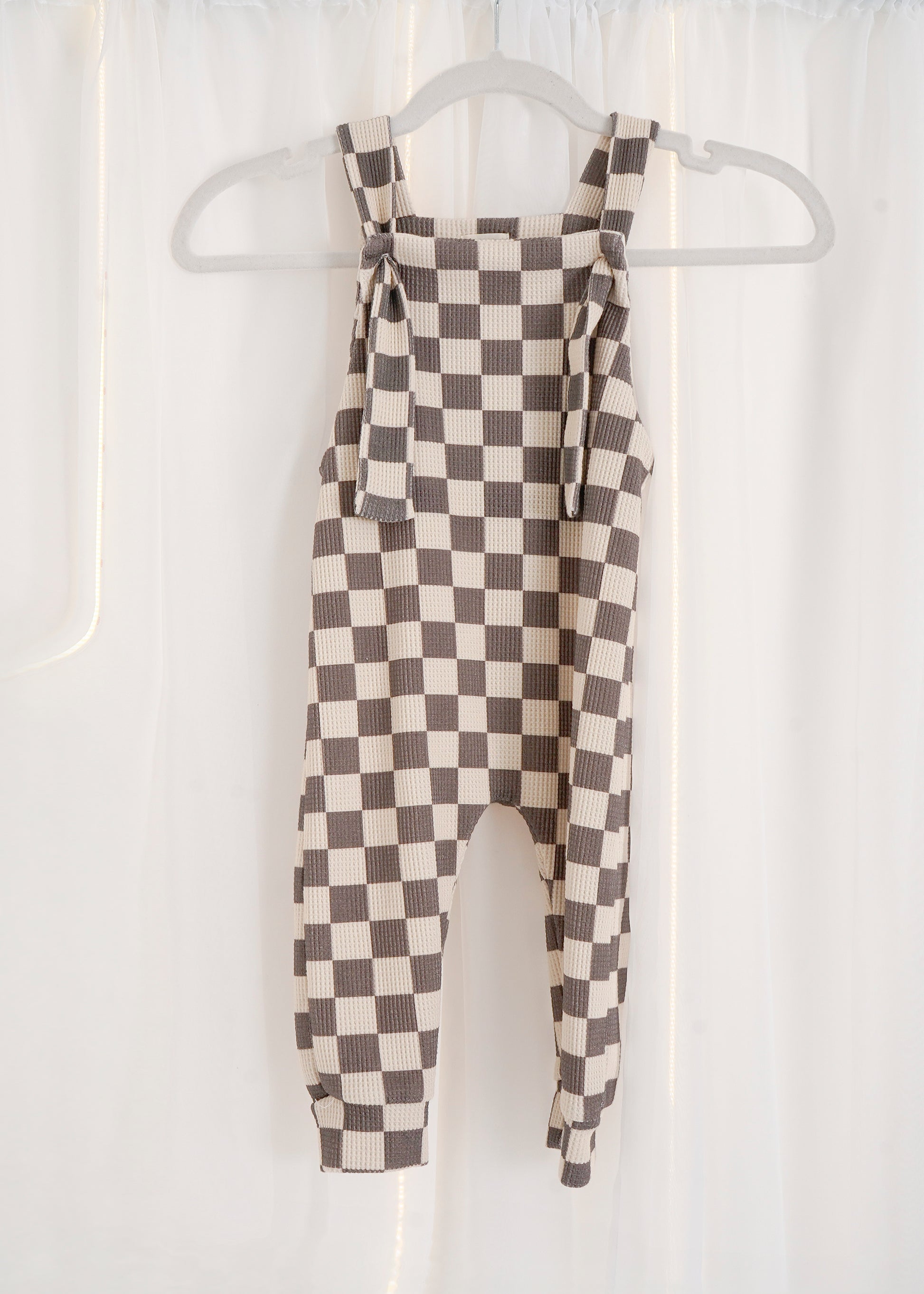 grey and white checked dungarees